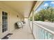 Long covered porch with nice seating overlooking the pool at 1085 Harmony Ln, Clermont, FL 34711