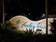 Picturesque Floridays Resort sign surrounded by lush tropical landscaping at 12527 Floridays Resort Dr # 406-E, Orlando, FL 32821