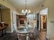 Dining room boasts a glass table, seating for six, and hardwood flooring at 12527 Floridays Resort Dr # 406-E, Orlando, FL 32821