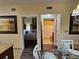 Hallway view showing bedroom and bathroom doors from the dining room at 12527 Floridays Resort Dr # 406-E, Orlando, FL 32821