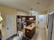 Well-equipped kitchen with stainless steel appliances and a cozy island for meal preparation and casual dining at 12527 Floridays Resort Dr # 406-E, Orlando, FL 32821