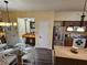 Open-concept kitchen and dining area with an island and stainless steel appliances at 12527 Floridays Resort Dr # 406-E, Orlando, FL 32821