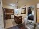 A kitchen featuring a center island, stainless steel appliances, and tile flooring at 12527 Floridays Resort Dr # 406-E, Orlando, FL 32821