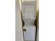 Laundry closet with a stacked washer and dryer unit at 12527 Floridays Resort Dr # 406-E, Orlando, FL 32821
