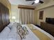 Bright main bedroom featuring a plush king-size bed, soft lighting, and a cozy, relaxing atmosphere at 12527 Floridays Resort Dr # 406-E, Orlando, FL 32821