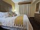 Comfortable main bedroom featuring a plush king-size bed, soft lighting, and a cozy, relaxing atmosphere at 12527 Floridays Resort Dr # 406-E, Orlando, FL 32821
