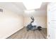 Exercise room with skylight and wood laminate flooring at 12765 Se 143Rd Ave, Ocklawaha, FL 32179