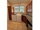 Bright laundry room featuring washer, dryer, custom cabinets, and granite countertops at 12765 Se 143Rd Ave, Ocklawaha, FL 32179