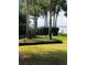 Lush lawn featuring mature palm trees and visiting Sandhill Cranes at 12765 Se 143Rd Ave, Ocklawaha, FL 32179