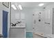 Bathroom features granite countertops and a glass shower at 1305 Guerra Ave, The Villages, FL 32159