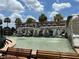 Beautiful fountain area with waterfall feature, complemented by nearby benches for relaxation at 1305 Guerra Ave, The Villages, FL 32159