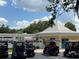 Image of the golf cart parking with the recreation center in the background at 1305 Guerra Ave, The Villages, FL 32159