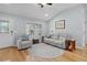 Inviting living room with hardwood floors, comfortable seating, and a cozy atmosphere at 1305 Guerra Ave, The Villages, FL 32159