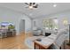 Bright living room with hardwood floors, a ceiling fan, and comfortable seating at 1305 Guerra Ave, The Villages, FL 32159