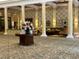 Elegant lobby with floral centerpiece, patterned wallpaper, and plush seating area providing a welcoming ambiance at 1305 Guerra Ave, The Villages, FL 32159