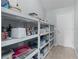 Pantry features ample shelving for storage at 1305 Guerra Ave, The Villages, FL 32159