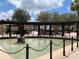 A charming statue next to pond under shaded pergola in the community's park at 1305 Guerra Ave, The Villages, FL 32159