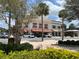 Charming street view with a tree-lined street, storefronts, and well-maintained landscaping at 1305 Guerra Ave, The Villages, FL 32159