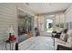 Cozy sunroom with seating, large windows, access to kitchen and backyard at 1305 Guerra Ave, The Villages, FL 32159