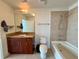 Well-lit bathroom featuring a tiled shower and bathtub combination and a granite countertop vanity at 155 S Court Ave # 1801, Orlando, FL 32801