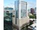 A striking high-rise building with sleek architecture and glass windows stands tall in the city skyline at 155 S Court Ave # 1801, Orlando, FL 32801