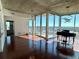Open living space featuring hardwood floors, modern lighting, and floor to ceiling windows with stunning views at 155 S Court Ave # 1801, Orlando, FL 32801
