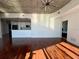 Hardwood floors, concrete ceilings, and modern kitchen in an open living space with lots of natural light at 155 S Court Ave # 1801, Orlando, FL 32801