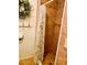Shower with tiled walls, tiled flooring and a green foliage shower curtain at 201 Jacaranda Dr, Leesburg, FL 34748