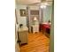 Charming bedroom with laminate wood flooring, neutral wall color, and comfortable furnishings at 201 Jacaranda Dr, Leesburg, FL 34748