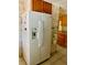 Spacious refrigerator in a kitchen with ample cabinet space at 201 Jacaranda Dr, Leesburg, FL 34748