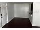Bright living room with white walls and wood-look flooring throughout home at 2013 Dixie Belle Dr # 2013K, Orlando, FL 32812