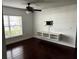 Living room featuring a ceiling fan, hardwood floors, and a window at 2013 Dixie Belle Dr # 2013K, Orlando, FL 32812
