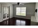 Living room with hardwood floors and large windows at 2013 Dixie Belle Dr # 2013K, Orlando, FL 32812