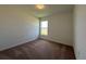 Bedroom featuring carpet floors and a large window allowing for natural light at 2117 Emma Ln, Lake Wales, FL 33898