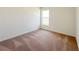 Bedroom with carpeted floors, natural light, and minimalist decor at 2117 Emma Ln, Lake Wales, FL 33898