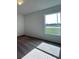 Bedroom featuring carpet floors and a large window allowing for natural light at 2117 Emma Ln, Lake Wales, FL 33898