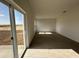 Bright living area with sliding glass doors leading to an outdoor patio, and ceramic tile flooring at 2117 Emma Ln, Lake Wales, FL 33898