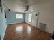 Spacious bedroom featuring wood-look floors, natural light, and blue walls at 2216 Weber St, Lakeland, FL 33801
