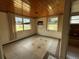 Sunroom with tile flooring, natural light, and an air conditioning unit at 2216 Weber St, Lakeland, FL 33801