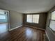 This bedroom is well-lit by natural light and has wood-look floors at 2216 Weber St, Lakeland, FL 33801
