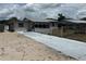 Quaint single-story home showcasing a driveway and neutral gray paint at 2216 Weber St, Lakeland, FL 33801