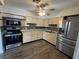 Bright kitchen with stainless steel appliances and decorative backsplash at 2216 Weber St, Lakeland, FL 33801