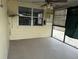 This patio has a window and fan with plenty of room for outdoor furniture at 2216 Weber St, Lakeland, FL 33801