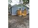The rear of the blue home features a newly constructed wooden porch and updated exterior at 2217 Azalea Ct, Lakeland, FL 33815