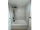 Newly renovated bathroom with white marble tile and matte black fixtures at 2217 Azalea Ct, Lakeland, FL 33815