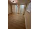 A well lit bedroom with a closet and laminate flooring throughout at 2217 Azalea Ct, Lakeland, FL 33815