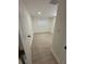 A bright bedroom is enhanced by laminate floors and a window for natural light at 2217 Azalea Ct, Lakeland, FL 33815