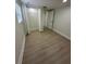 Bedroom includes closet space, a bright window and laminate flooring at 2217 Azalea Ct, Lakeland, FL 33815