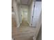 Bright hallway with updated laminate flooring, neutral walls, and white trim at 2217 Azalea Ct, Lakeland, FL 33815