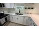 Bright kitchen featuring stainless steel appliances, white countertops, and black accents at 2217 Azalea Ct, Lakeland, FL 33815